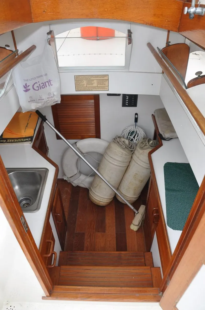 Slide: The Image of Interior of a 1987 Custom Sidewheel Paddle Yacht with wooden flooring and nautical equipment. - 21