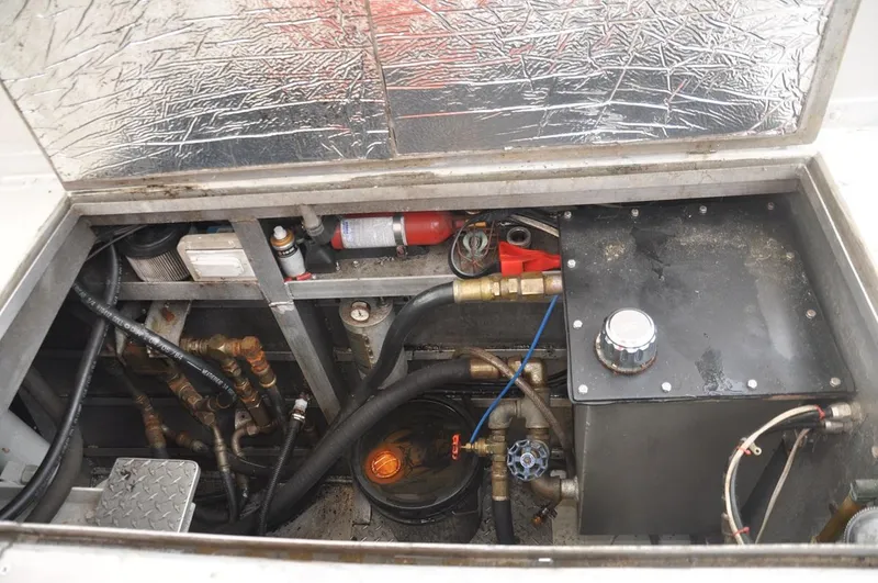 Slide: The Image of Engine compartment of a 1987 Custom Sidewheel Paddle Yacht, showing mechanical components and wiring. - 25