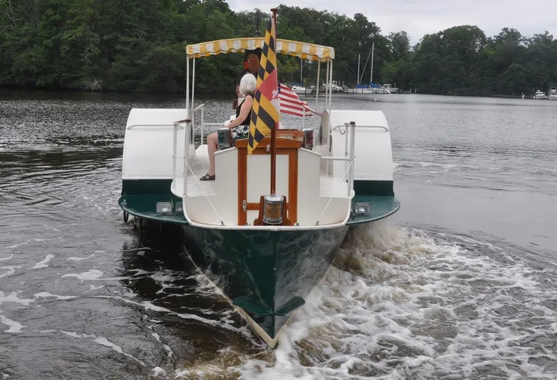 Slide: The Image of Custom 1987 sidewheel paddle yacht cruising on a calm river with passengers onboard. - 6