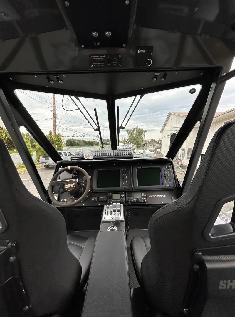 Slide: The Image of Interior cockpit of 2015 Titan 33 boat with advanced navigation controls. - 13