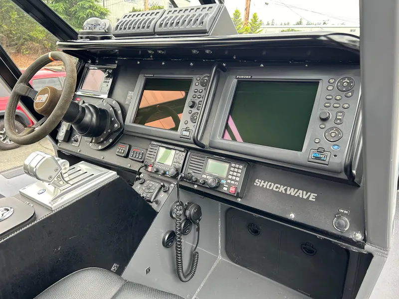 Slide: The Image of Control panel of a 2015 Titan 33 boat with advanced navigation equipment. - 8