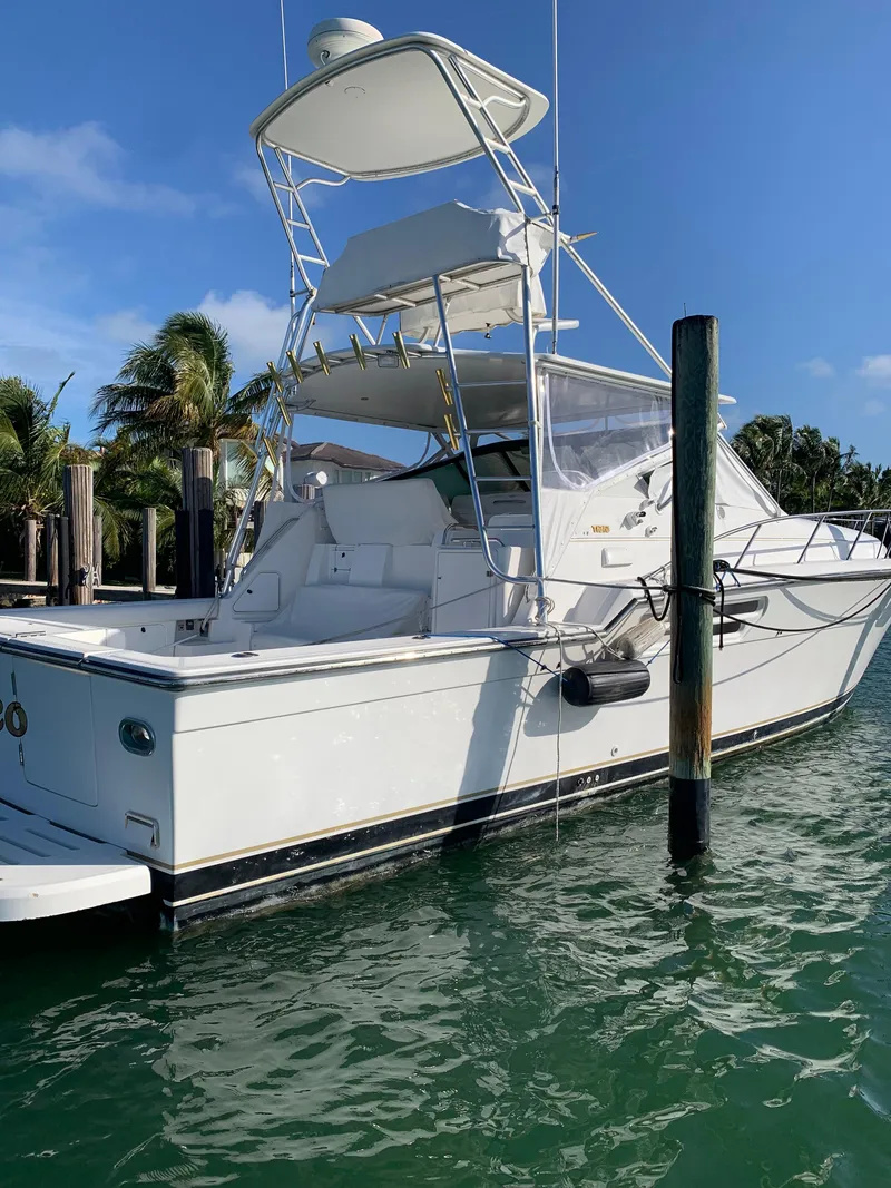 Slide: The Image of 1999 Tiara Yachts 43 Open docked in sunny marina. - 13