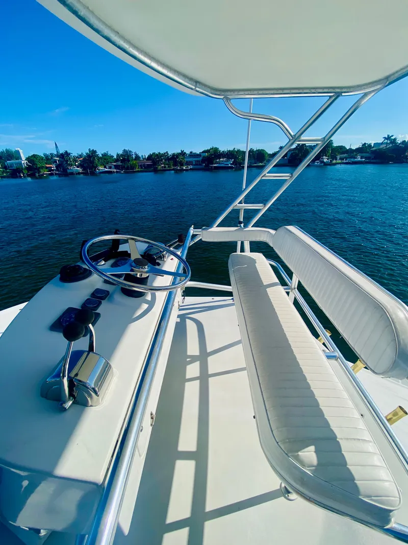 Slide: The Image of 1999 Tiara Yachts 43 Open helm with scenic water view. - 30