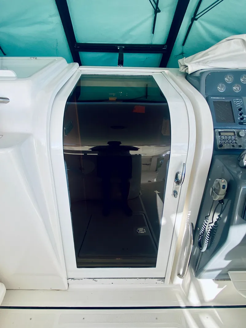 Slide: The Image of 1999 Tiara Yachts 43 Open cabin door and control panel. - 42