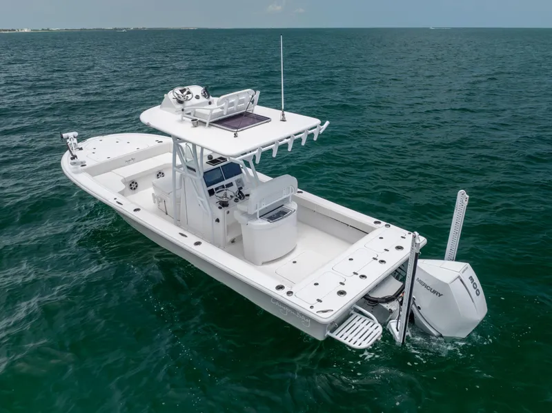 Slide: The Image of 2023 Canyon Bay 28h boat cruising on open water. - 12