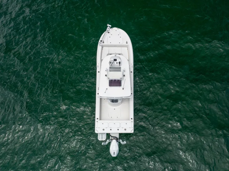 Slide: The Image of Aerial view of 2023 Canyon Bay 28h boat on green water. - 13