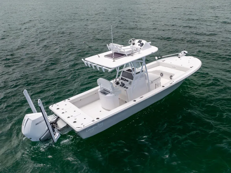 Slide: The Image of 2023 Canyon Bay 28h boat on open water, featuring sleek design and powerful engine. - 14