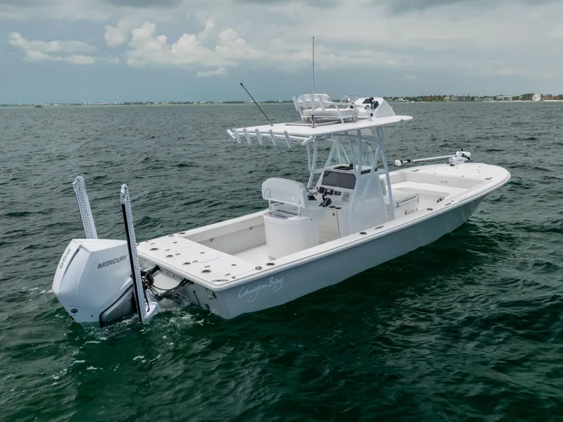 Slide: The Image of 2023 Canyon Bay 28h boat on open water, featuring a sleek design and powerful engine. - 15