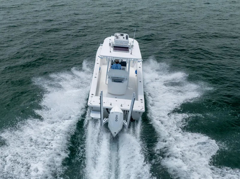 Slide: The Image of Canyon Bay 28h boat cruising on open water, 2023 model. - 2