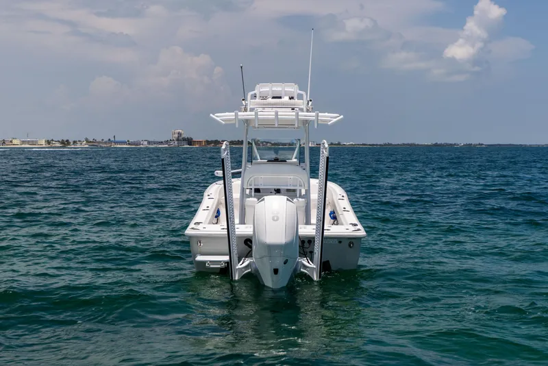 Slide: The Image of 2023 Canyon Bay 28h boat on open water, rear view. - 20