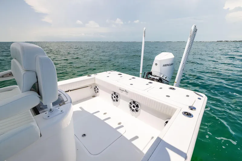 Slide: The Image of 2023 Canyon Bay 28h boat on open water, featuring spacious deck and modern design. - 22