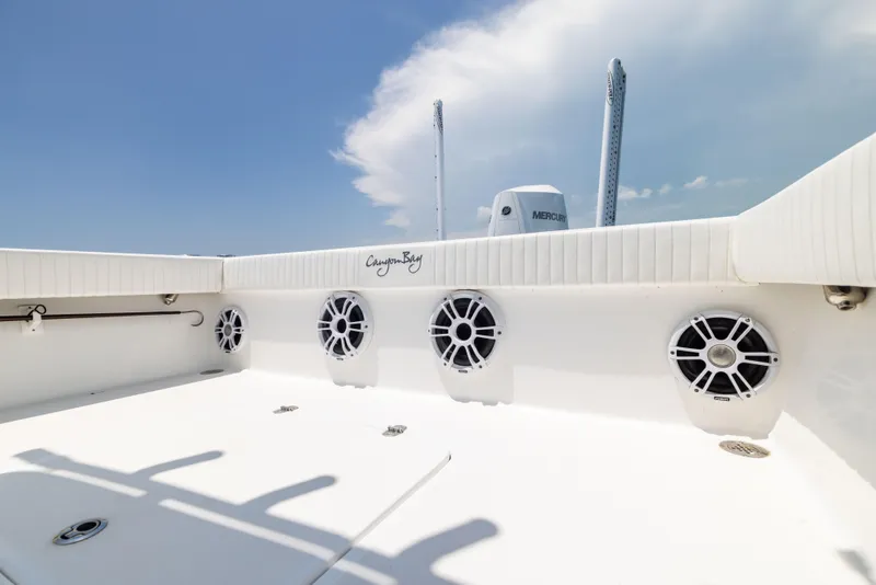 Slide: The Image of 2023 Canyon Bay 28h boat deck with speakers and clear sky. - 30