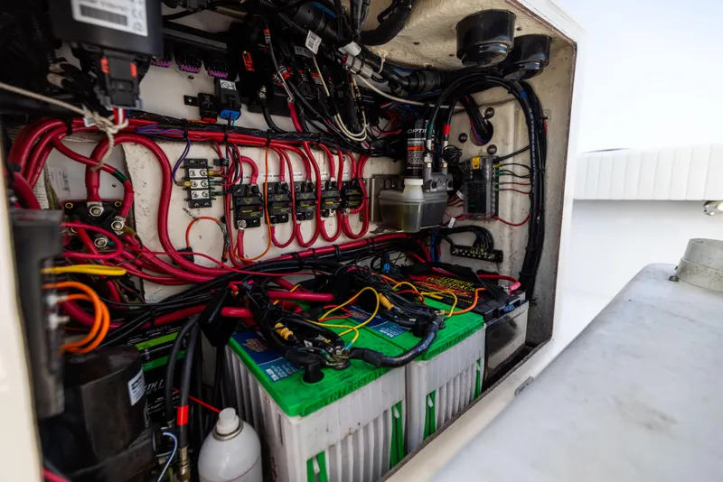 Slide: The Image of 2023 Canyon Bay 28h boat electrical system with batteries and wiring. - 45
