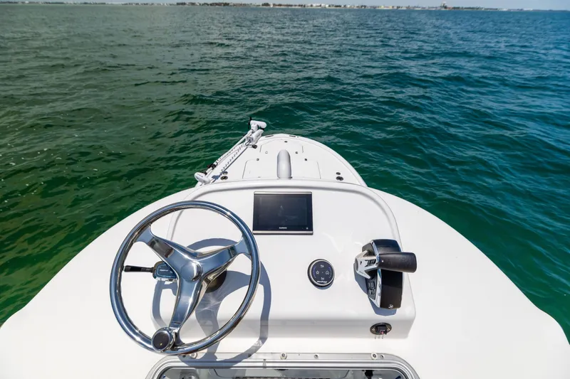 Slide: The Image of Canyon Bay 28h boat dashboard, 2023 model, on open water. - 49