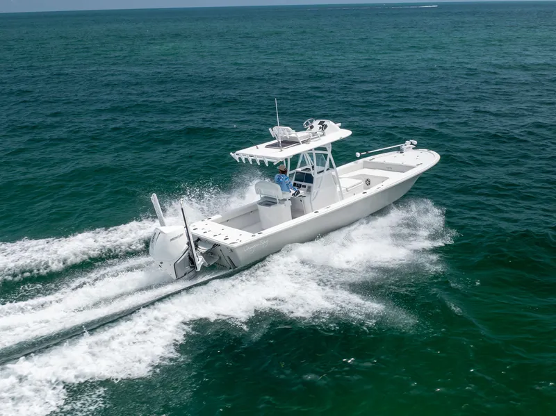 Slide: The Image of 2023 Canyon Bay 28h boat cruising on open ocean waters. - 5