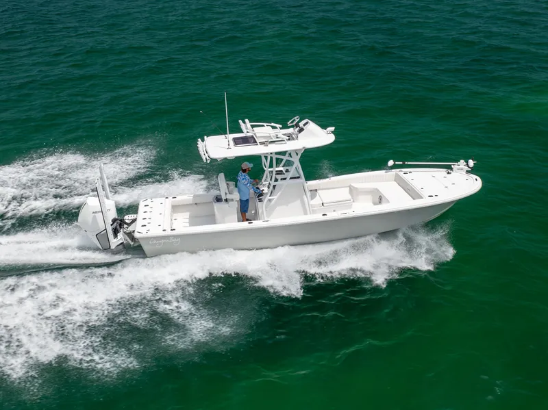 Slide: The Image of 2023 Canyon Bay 28h boat cruising on open water. - 6