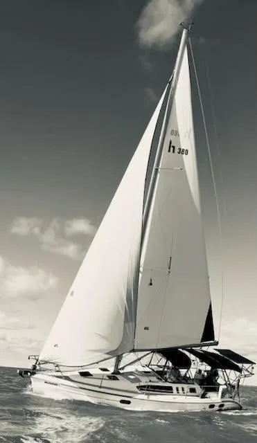 Slide: The Image of Sailing yacht Hunter 380, 2001 model, gliding on open sea under clear skies. - 0