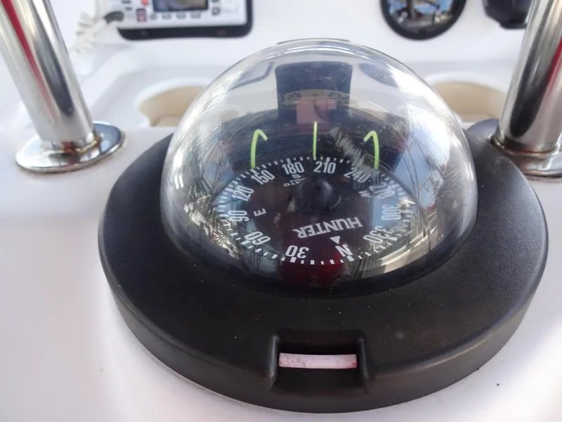 Slide: The Image of Compass on a 2001 Hunter 380 sailboat dashboard. - 15