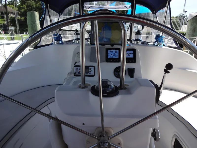 Slide: The Image of Steering wheel and dashboard of a 2001 Hunter 380 sailboat cockpit. - 17