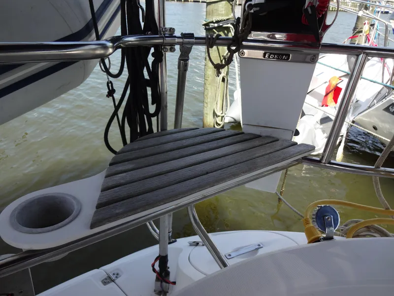 Slide: The Image of Hunter 380 sailboat cockpit detail, 2001 model, featuring wooden step and stainless steel railing. - 18