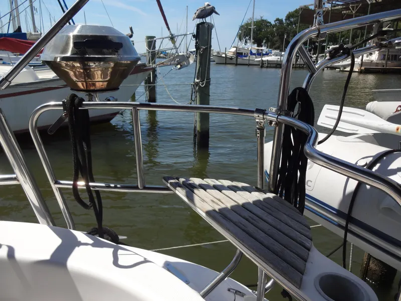 Slide: The Image of Hunter 380 sailboat deck with grill, docked at marina, 2001 model. - 19