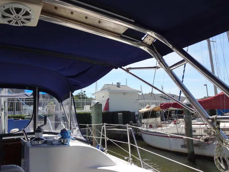 Slide: The Image of Hunter 380 sailboat cockpit view, 2001 model, docked at marina with blue canopy. - 23
