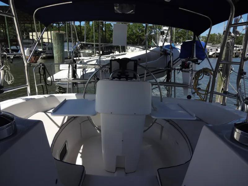 Slide: The Image of Interior view of 2001 Hunter 380 sailboat cockpit with steering wheel and seating. - 24