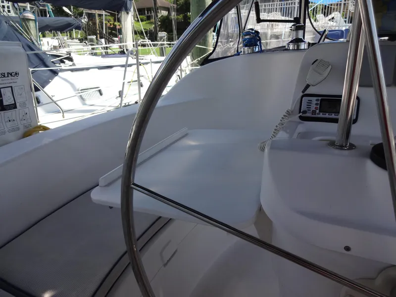 Slide: The Image of Cockpit of 2001 Hunter 380 sailboat with steering wheel and navigation equipment. - 25