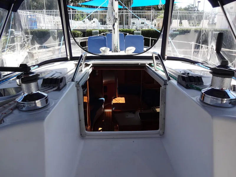Slide: The Image of Interior view of 2001 Hunter 380 sailboat cockpit with winches and seating. - 27