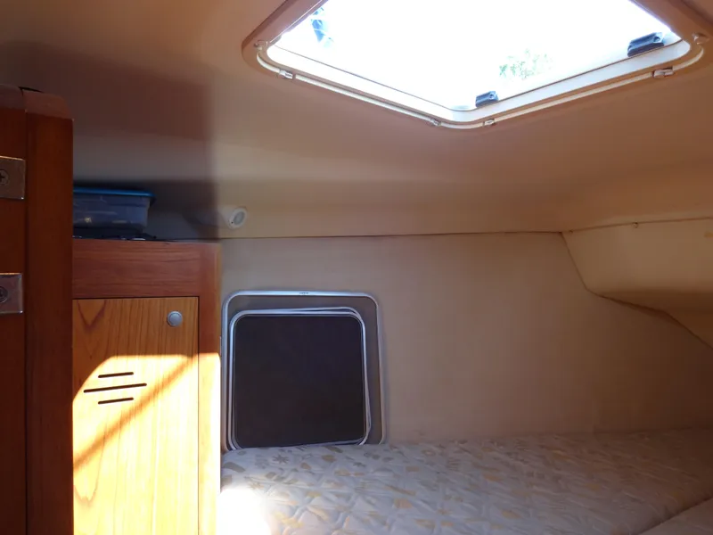 Slide: The Image of Cozy cabin interior of 2001 Hunter 380 sailboat with natural light. - 37