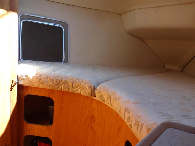 Slide: The Image of Cozy cabin interior of 2001 Hunter 380 sailboat with comfortable bedding. - 38