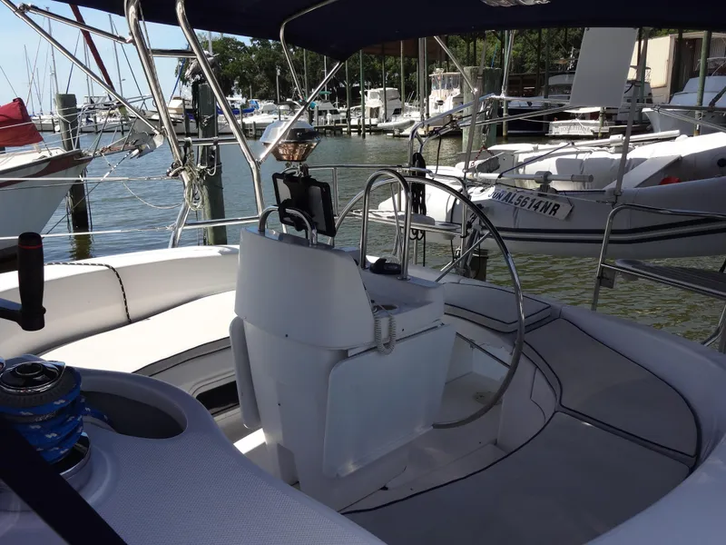Slide: The Image of Hunter 380 sailboat cockpit, 2001 model, docked at marina with other boats. - 7