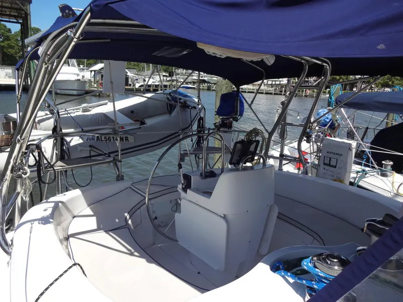 Slide: The Image of Cockpit of a 2001 Hunter 380 sailboat docked at a marina. - 9