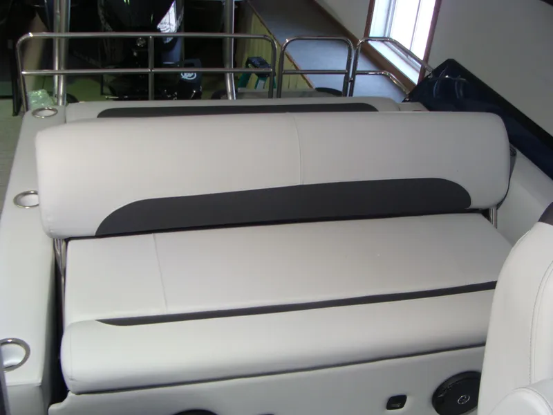 Slide: The Image of 2024 Bentley Pontoons 243 Swingback interior seating with sleek, modern design. - 12