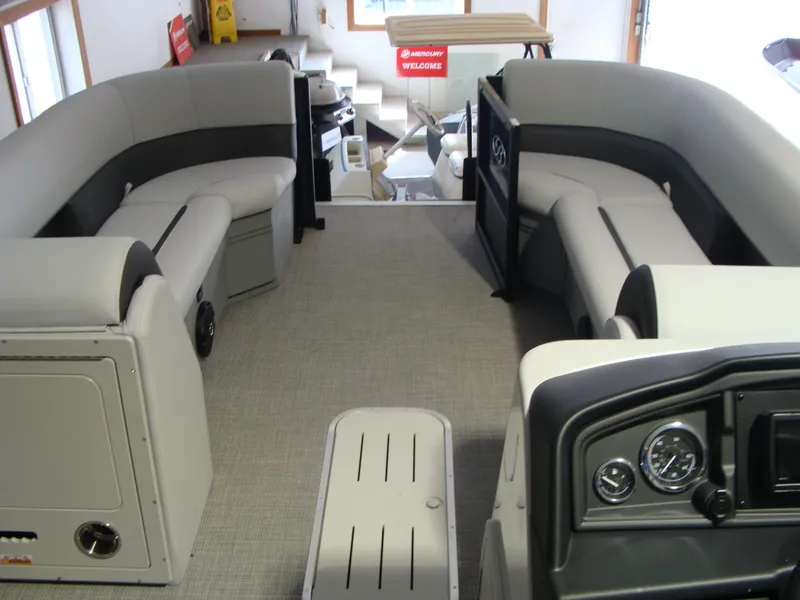 Slide: The Image of 2024 Bentley Pontoons 243 Swingback interior with spacious seating and modern dashboard. - 13