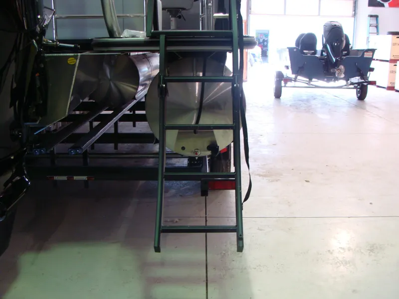 Slide: The Image of 2024 Bentley Pontoons 243 Swingback with ladder in a showroom. - 3