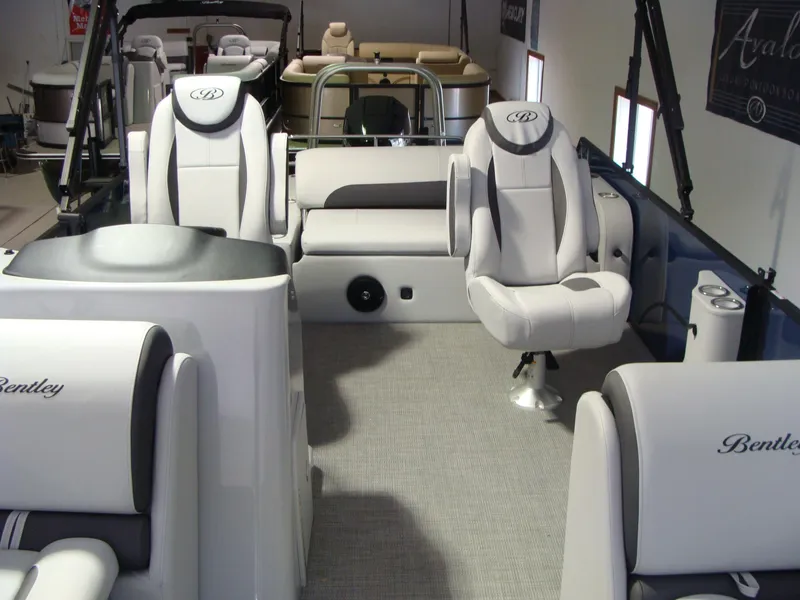Slide: The Image of 2024 Bentley Pontoons 243 Swingback interior with luxurious seating and modern design. - 4