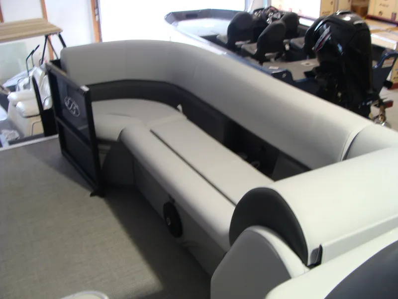 Slide: The Image of 2024 Bentley Pontoons 243 Swingback interior with plush seating and modern design. - 7