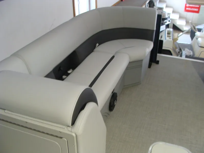 Slide: The Image of 2024 Bentley Pontoons 243 Swingback interior seating, featuring luxurious gray upholstery. - 8