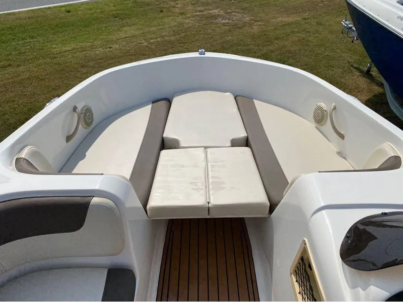 Slide: The Image of 2020 Bayliner Element E18 boat interior with cushioned seating and speakers. - 10