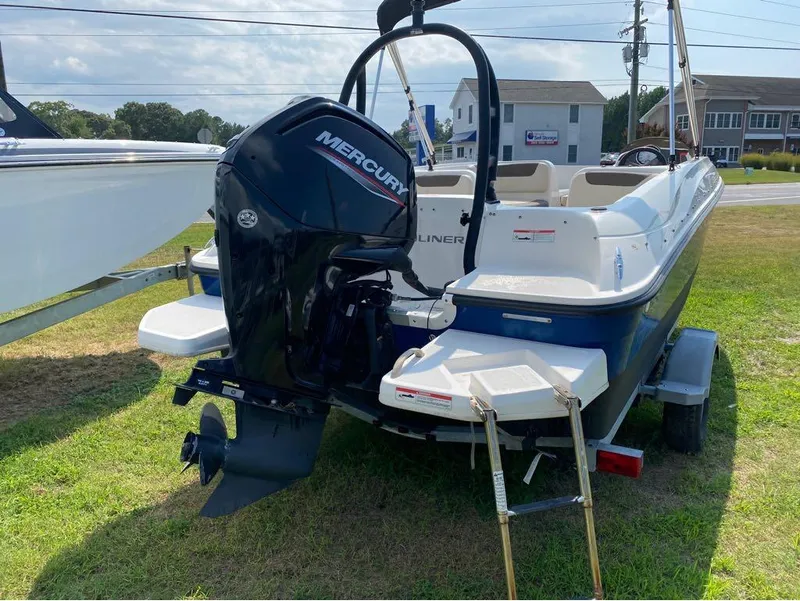 Slide: The Image of 2020 Bayliner Element E18 boat with Mercury outboard motor on trailer. - 6