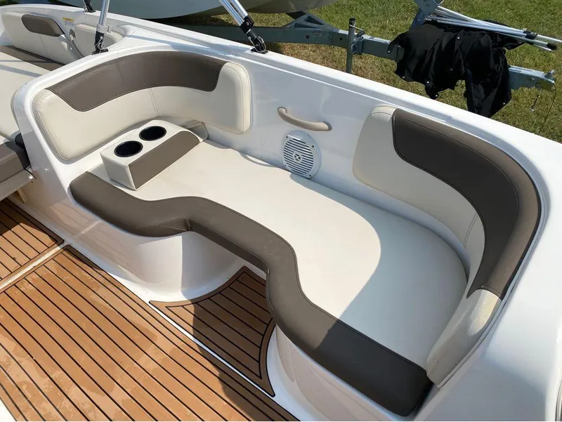 Slide: The Image of 2020 Bayliner Element E18 boat seating with cup holders and teak flooring. - 9
