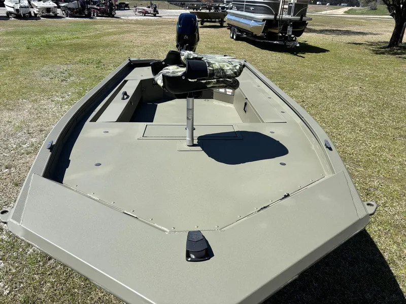 Slide: The Image of 2025 Tracker Grizzly 1654 T SportMan boat on grass, featuring a camouflage seat. - 12
