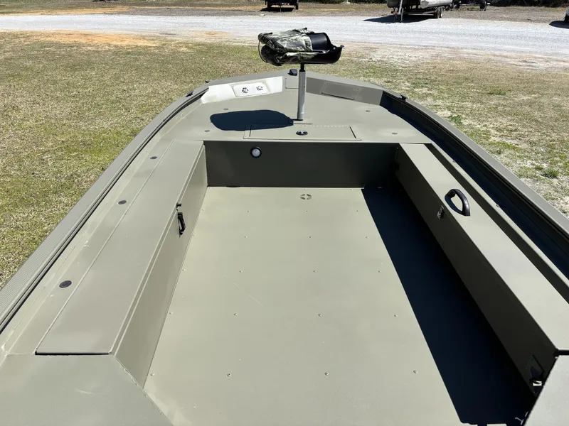 Slide: The Image of 2025 Tracker Grizzly 1654 T SportMan boat interior, featuring spacious deck and camo seat. - 8
