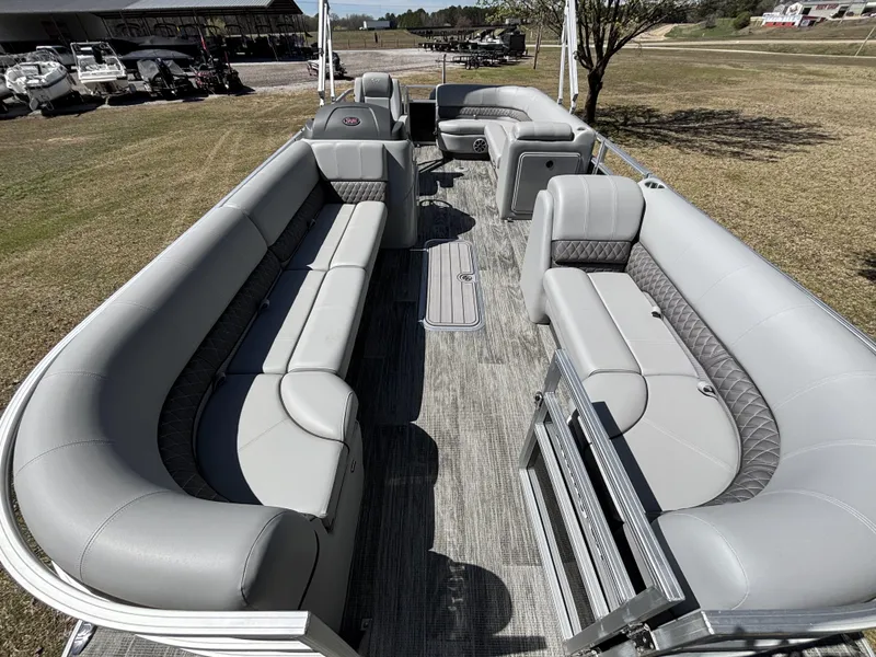 Slide: The Image of 2024 Ranger 223C pontoon boat with spacious seating and modern design. - 11