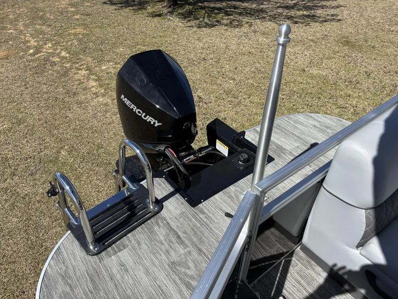 Slide: The Image of 2024 Ranger 223C boat with Mercury outboard motor and ladder on deck. - 14