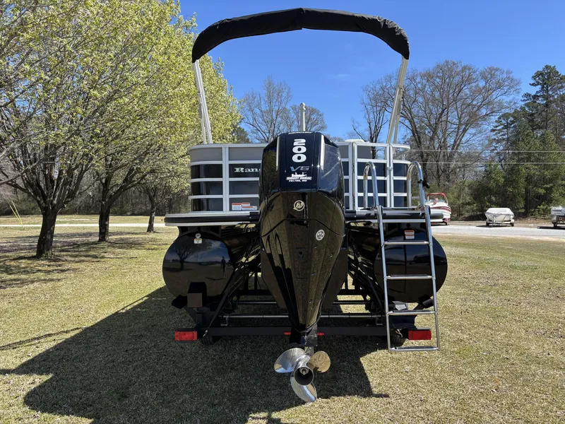 Slide: The Image of 2024 Ranger 223C pontoon boat with powerful V6 engine, parked on grassy area. - 9