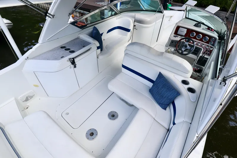 Slide: The Image of Interior of a 2005 Formula 280 Bowrider boat with white seating area. - 1