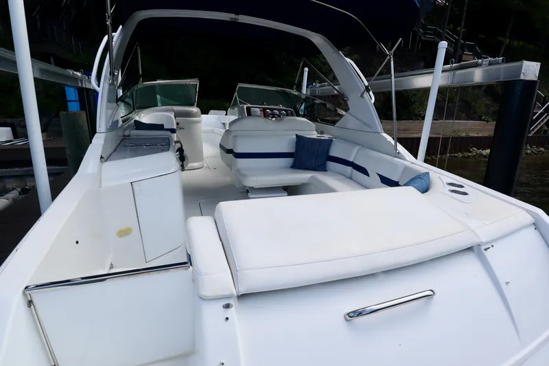 Slide: The Image of 2005 Formula 280 Bowrider boat with spacious deck and seating area. - 12