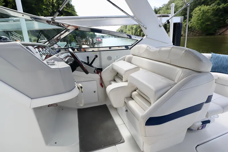 Slide: The Image of Interior of a 2005 Formula 280 Bowrider boat with white leather seating. - 18